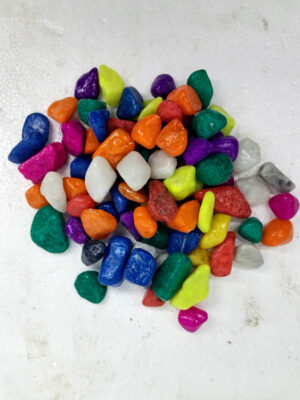 "Display of vibrant Rainbow Aquarium Stones available at Happy Fish and Pet, a local aquarium shop in Kukatpally, showcasing an assortment of colorful stones suitable for enhancing both freshwater and saltwater aquariums."