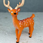 Handcrafted artificial spotted deer toy for aquariums, non-toxic and safe, realistic wildlife-themed aquarium decor.