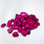 "Close-up of vibrant pink aquarium stones available at Happy Fish and Pet, a local aquarium shop in Kukatpally, showcasing their polished surfaces and suitability for enhancing aquascapes in freshwater and saltwater tanks."