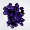 "Close-up of vibrant purple aquarium stones available at Happy Fish and Pet, a local aquarium shop in Kukatpally, showcasing their polished surfaces and suitability for enhancing aquascapes in both freshwater and saltwater tanks."